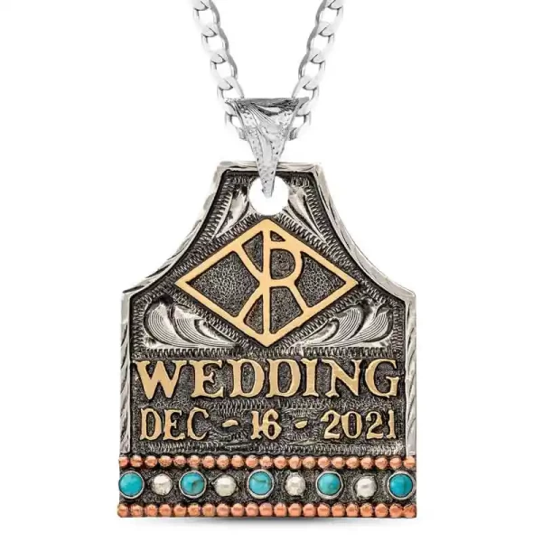 "The Waylon Cow Tag Necklace is crafted on a hand engraved, German Silver base with an antique finish. It's detailed with Copper beading, Jeweler's Bronze lettering and beautiful turquoise stones. 1.75"" x 1.5""

Pair with a Ste